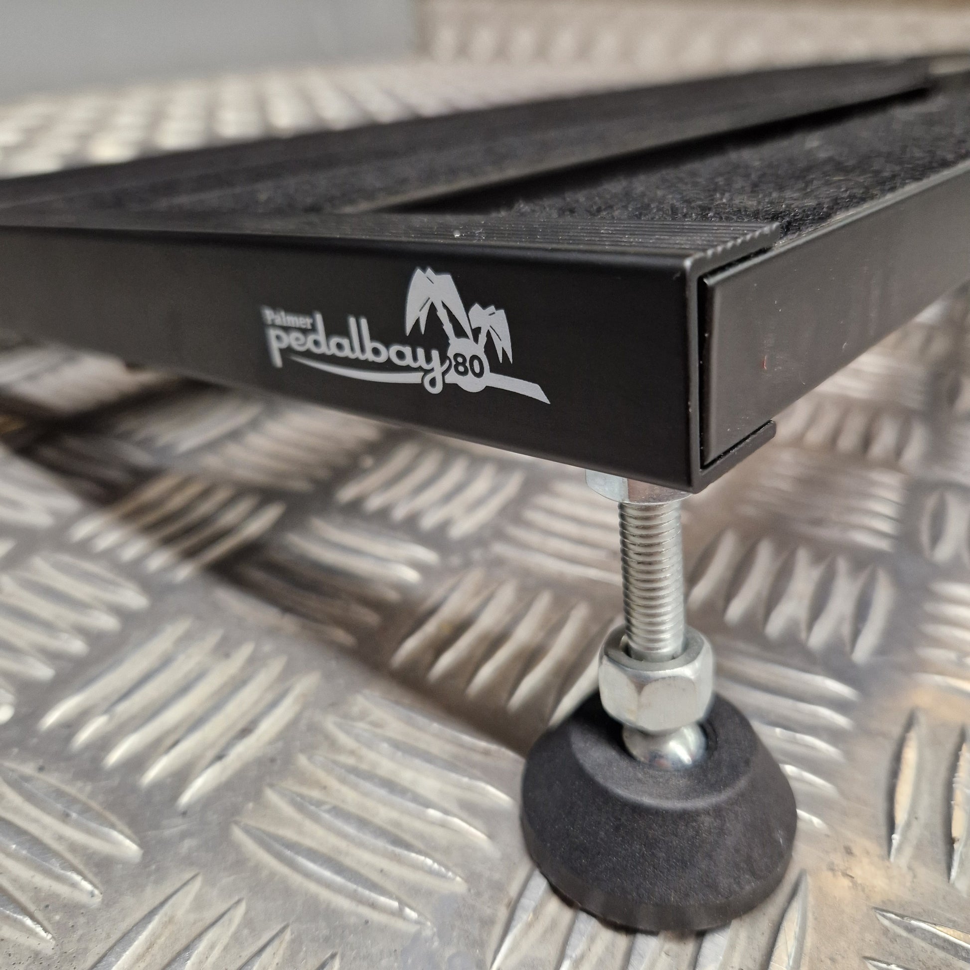 Pre-Owned Palmer Black metal tool with a visible brand logo on a textured metal surface