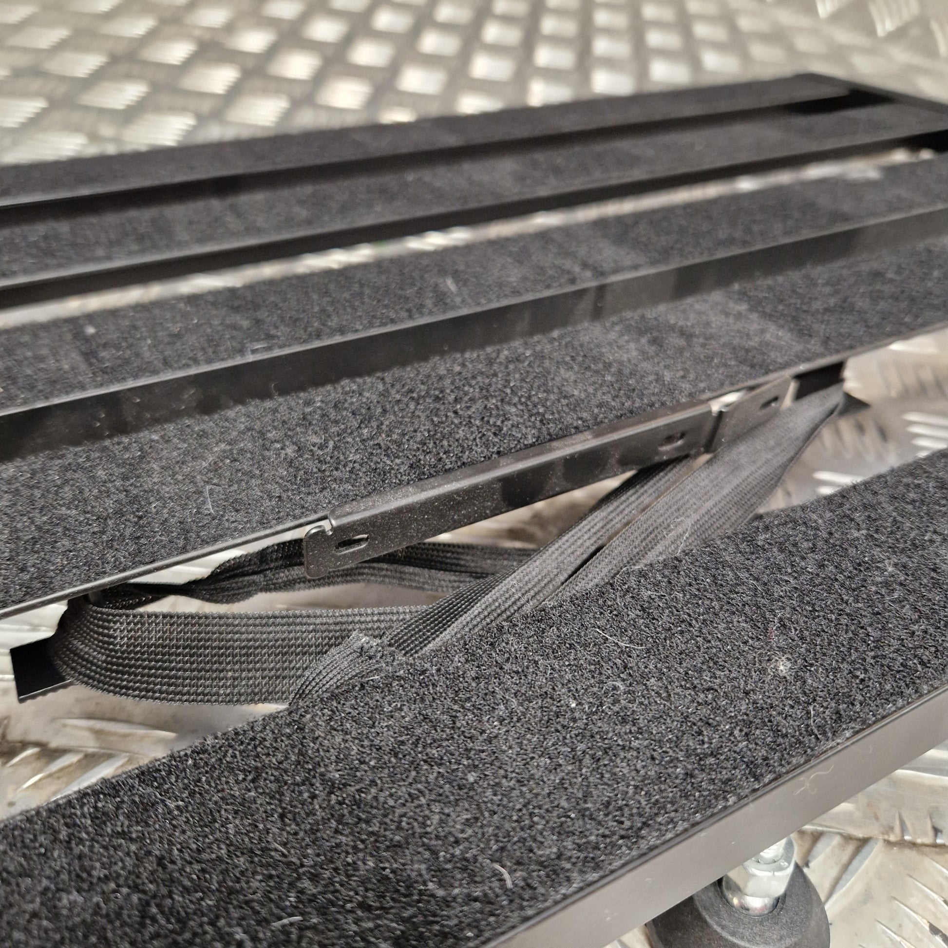 Pre-Owned Palmer Close-up of a metal frame with textured surface and straps