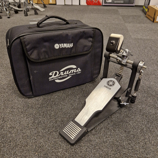 Pre-Owned Yamaha Yamaha drum hardware set with case on a gray floor