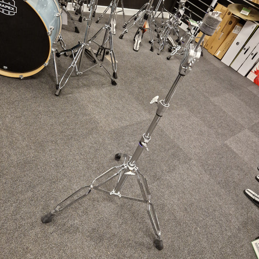 Pre-Owned Yamaha Drum stand on a gray floor with musical equipment around