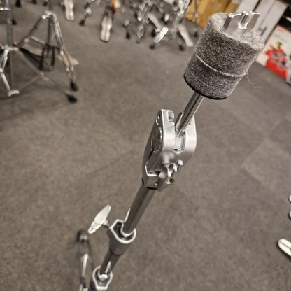 Pre-Owned Yamaha Close-up of a drumstick with a gray foam tip on a drum stand, blurred background