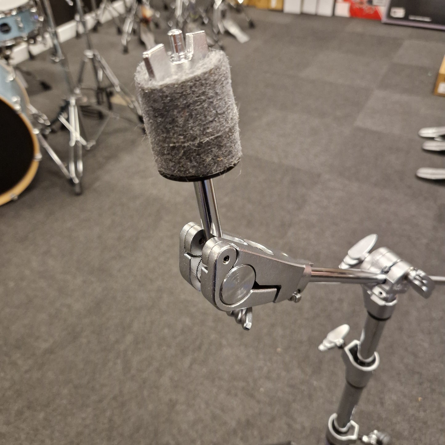 Pre-Owned Yamaha Close-up of a drum cymbal stand on a drum set with a gray background