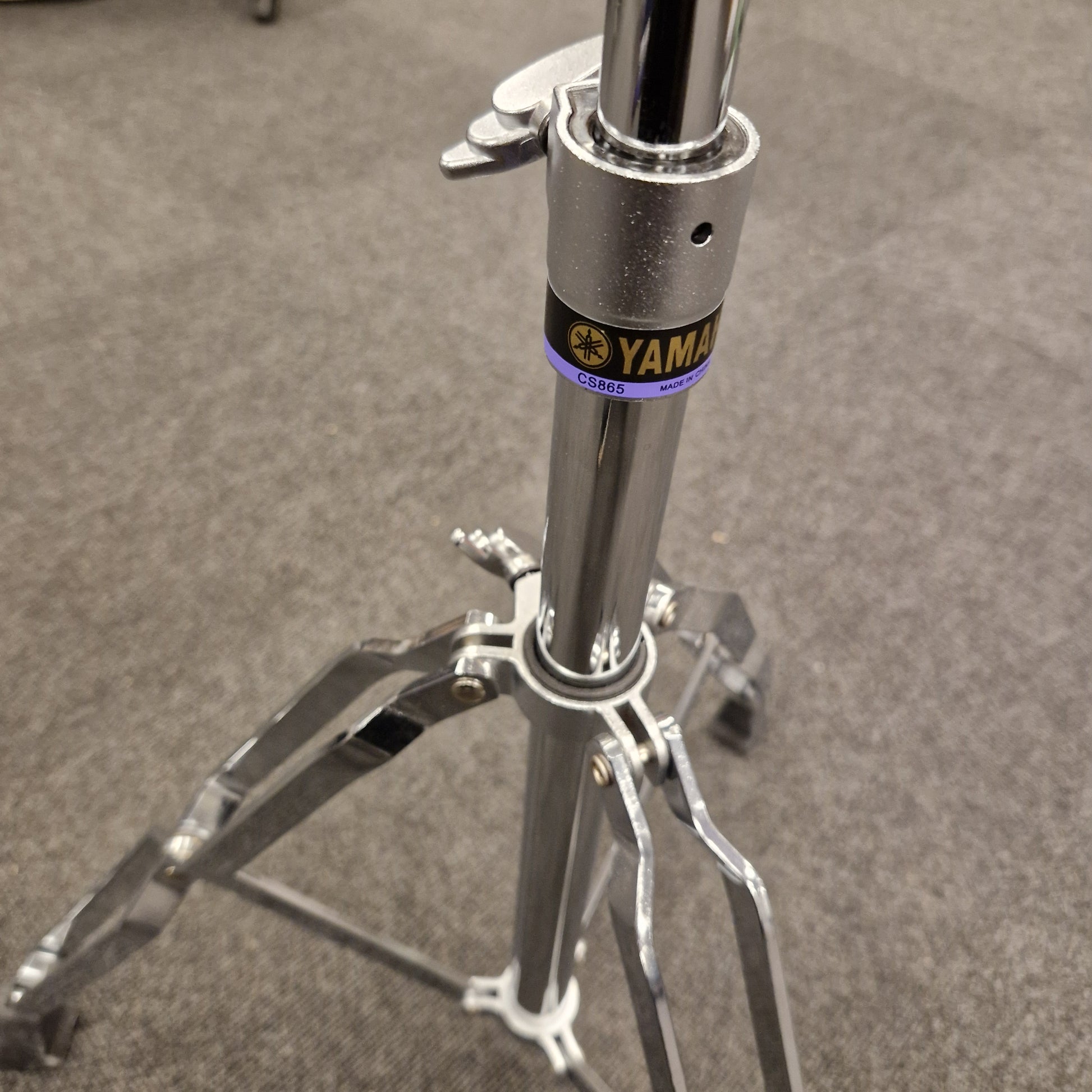 Pre-Owned Yamaha Close-up of a motorcycle suspension fork with 'Yamalube' branding on a gray background