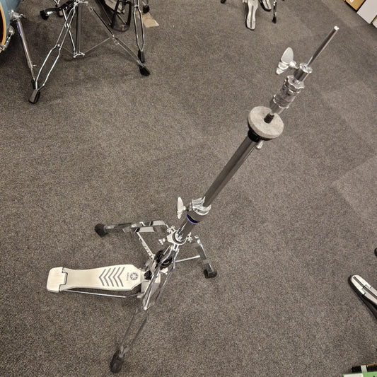 Pre-Owned Yamaha Drum stand on a gray floor with partial view of drums