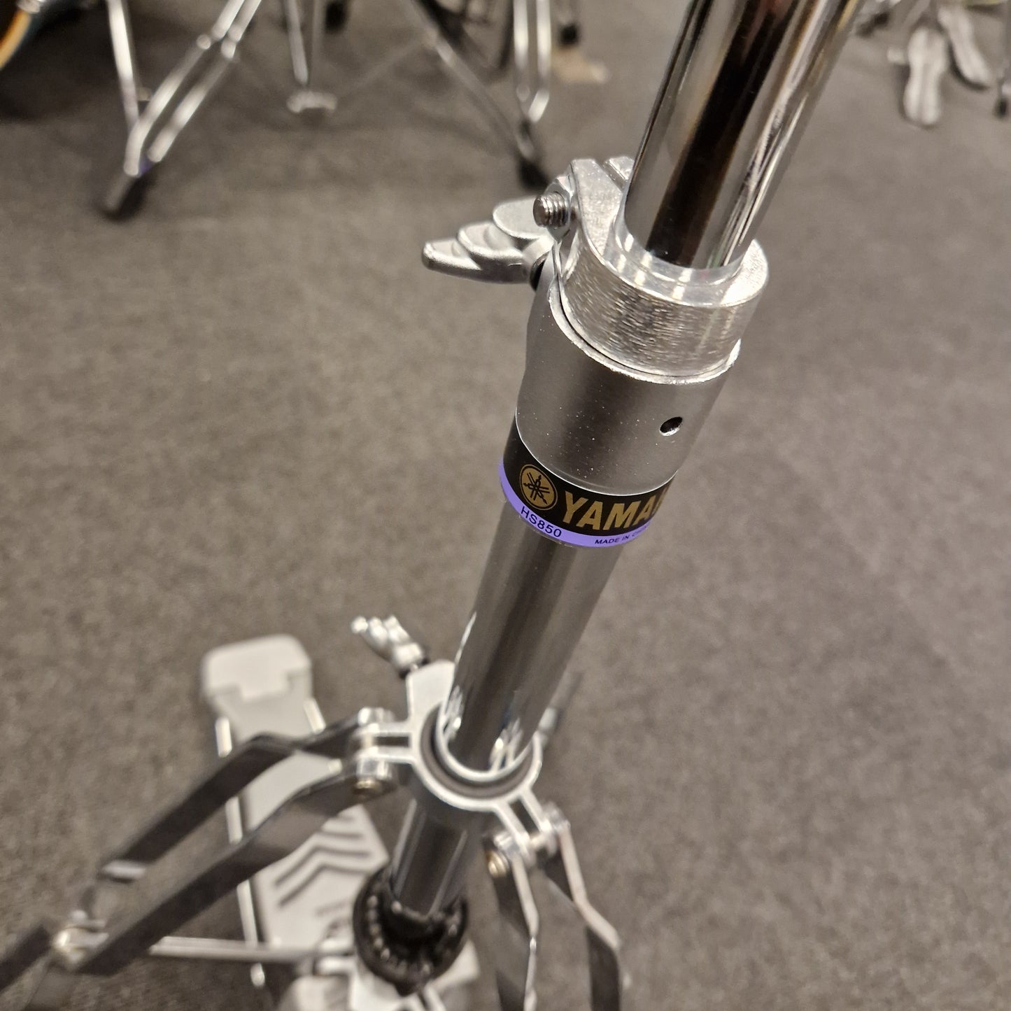 Pre-Owned Yamaha Close-up of a motorcycle suspension fork with 'Yamal' branding on a gray background