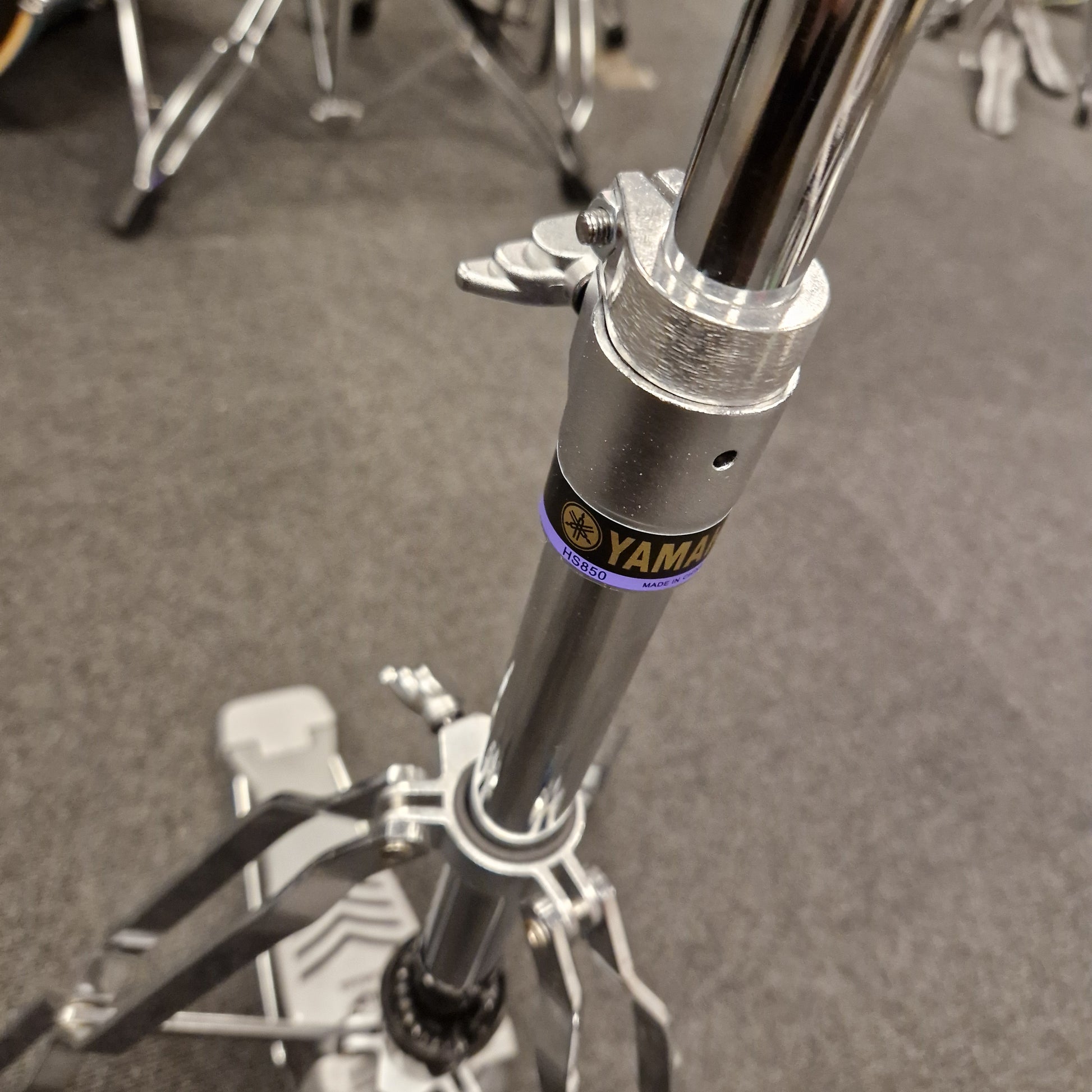 Pre-Owned Yamaha Close-up of a motorcycle suspension fork with 'Yamal' branding on a gray background