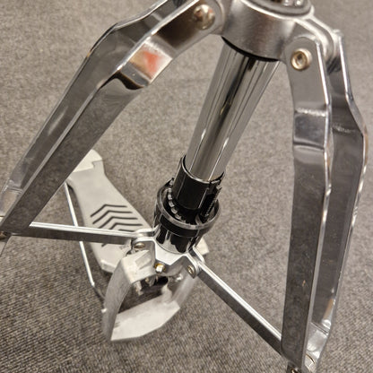 Pre-Owned Yamaha Close-up of a metal tripod stand on a textured surface