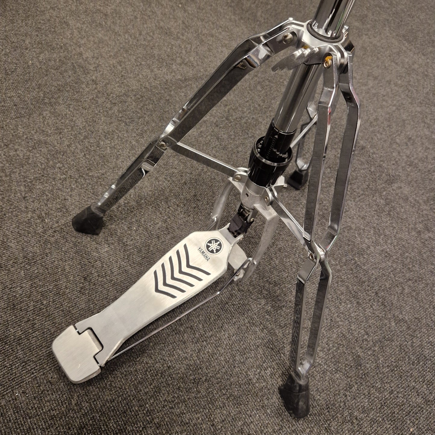 Pre-Owned Yamaha Close-up of a metallic drum pedal on a textured surface