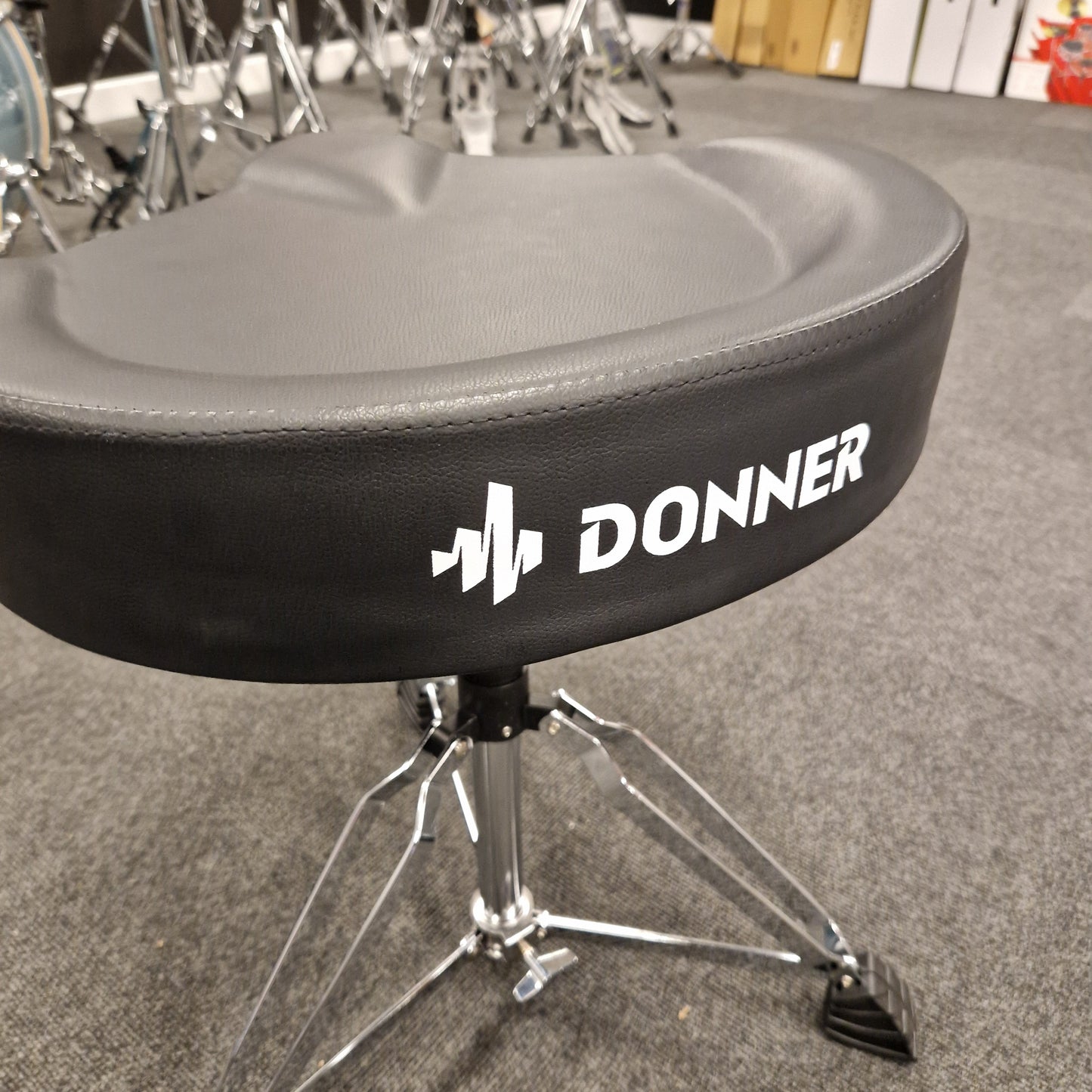 Pre-Owned Donner Drum pad with 'Donner' branding on a gray background