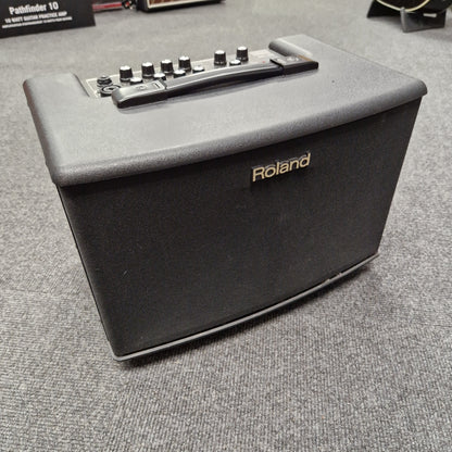 Pre-Owned Roland Roland keyboard amplifier on a textured surface