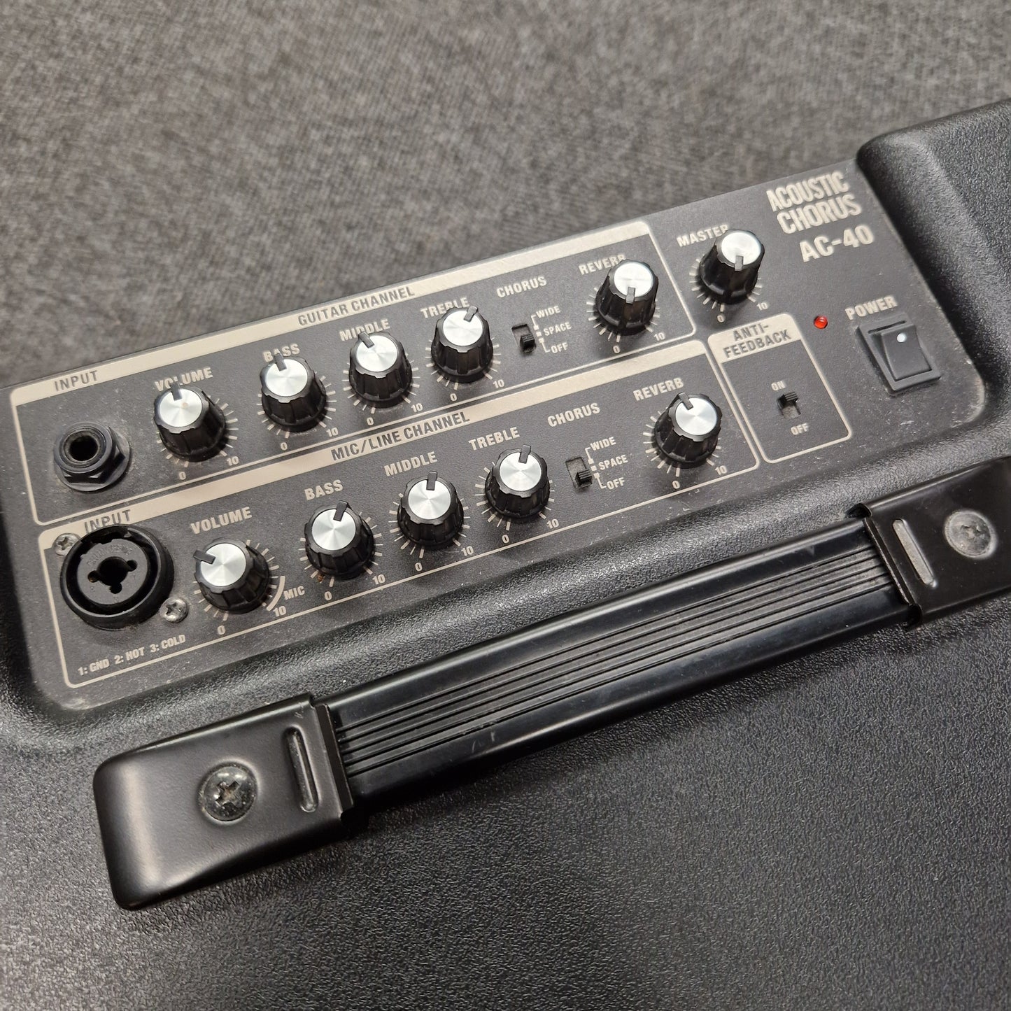 Pre-Owned Roland Close-up of a guitar effects pedal with control knobs on a gray background