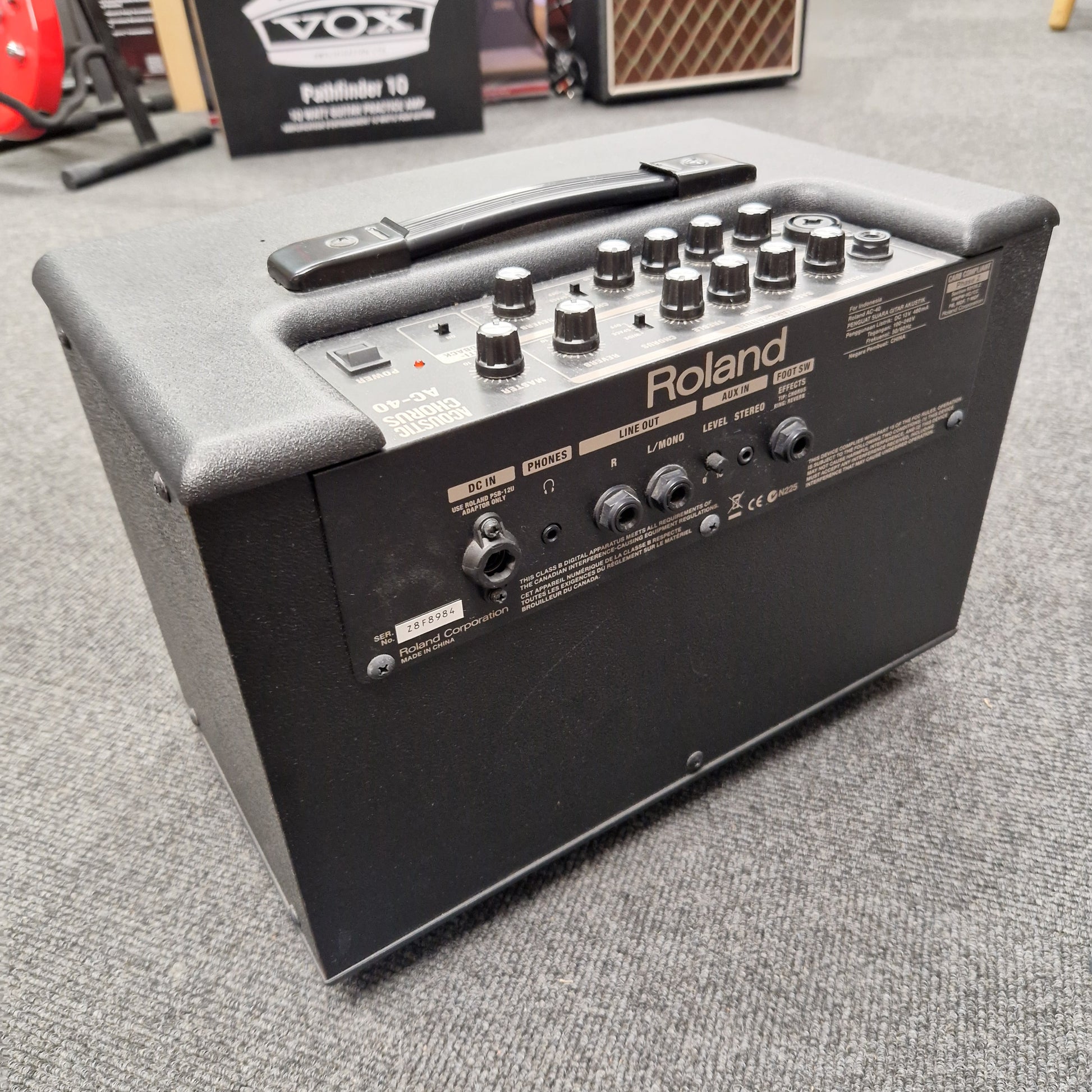Pre-Owned Roland Roland keyboard amplifier on a gray surface