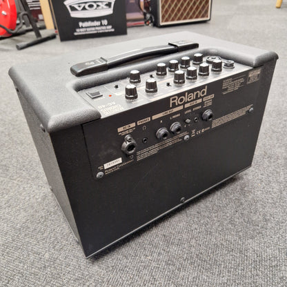 Pre-Owned Roland Roland keyboard amplifier on a gray surface