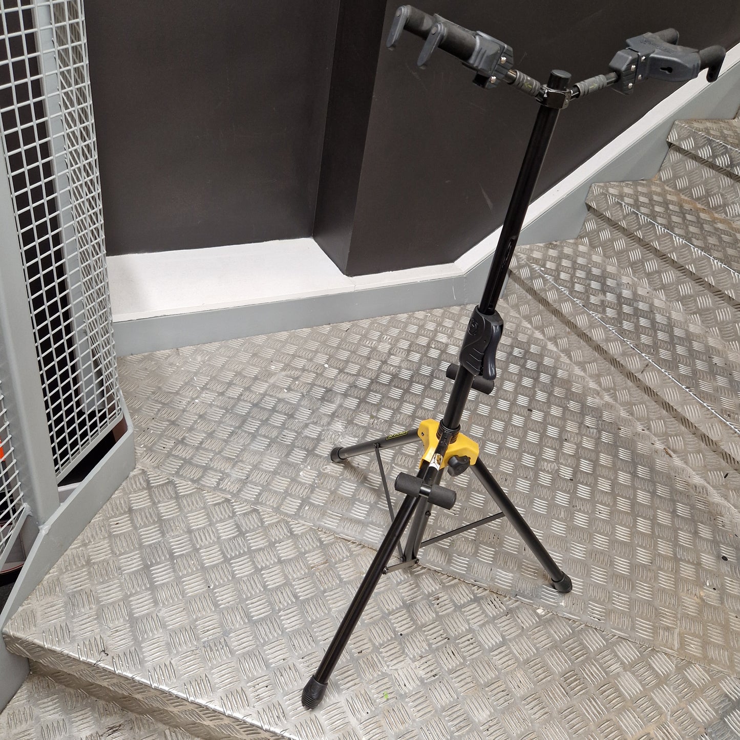 Pre-Owned Hercules Mechanical arm or crane in a workshop setting with a textured wall background