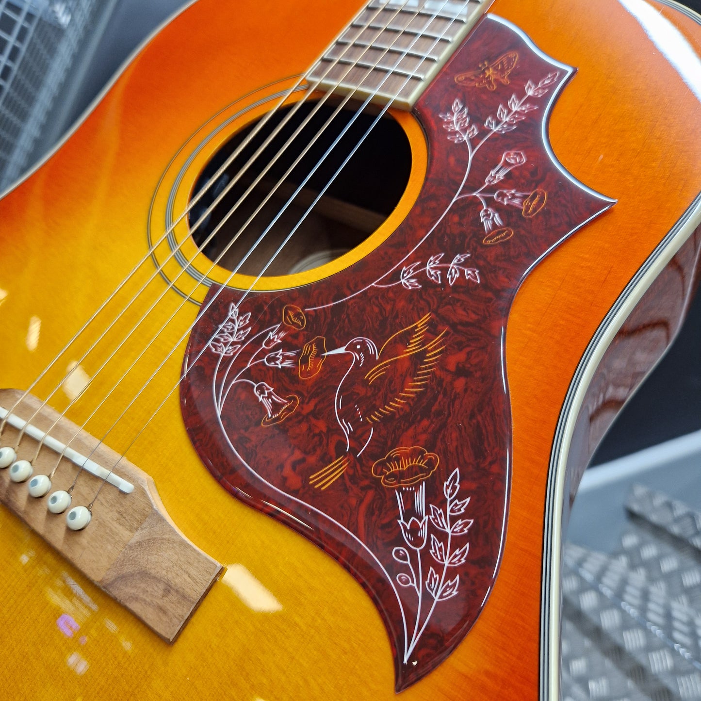 Pre-Owned Epiphone Close-up of an acoustic guitar with a decorative soundhole design.