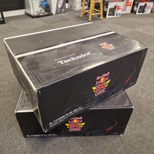 Pre-Owned Technics Two Technics boxes with Red Bull BC One branding on a gray floor.