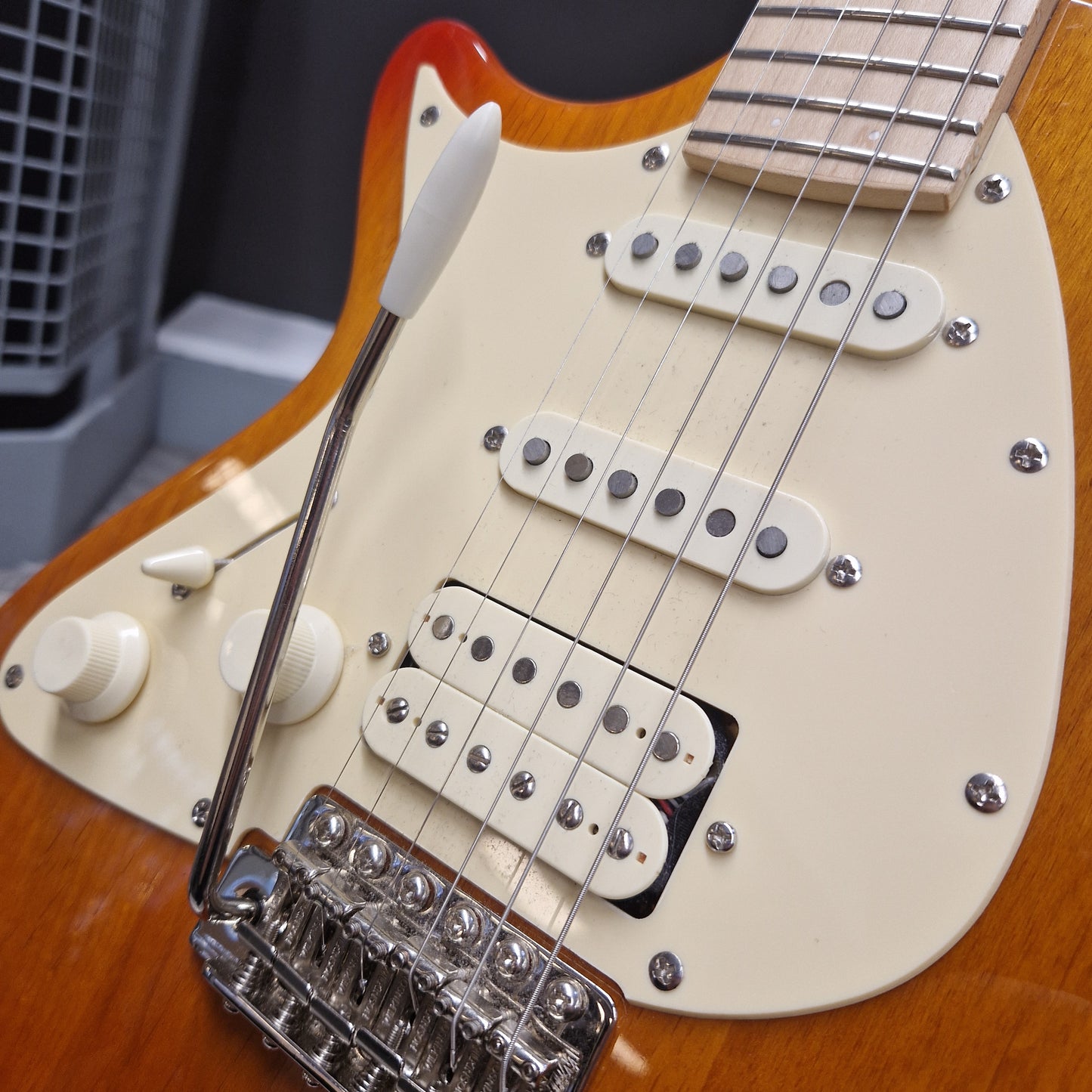 Pre-Owned Lag Close-up of a guitar's neck and headstock with a focus on the tuning pegs and strings.