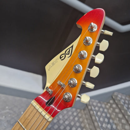 Pre-Owned Lag Close-up of a guitar headstock with brand logo against a blurred background