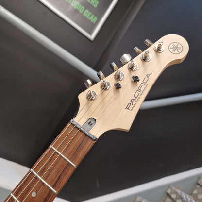 Pre-Owned Yamaha Close-up of a guitar headstock with 'Pacifica' branding on a blurred background
