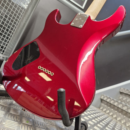 Pre-Owned Yamaha Red electric guitar body on a stand with a metallic background