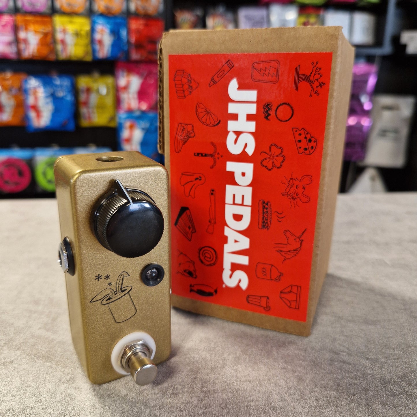 Pre-Owned JHS Guitar effects pedal with JHS Pedals packaging in a store setting