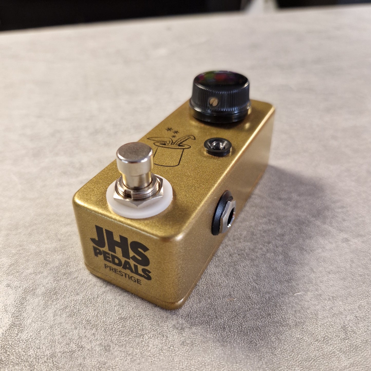 Pre-Owned JHS Gold JHS Pedals guitar effects pedal on a gray surface