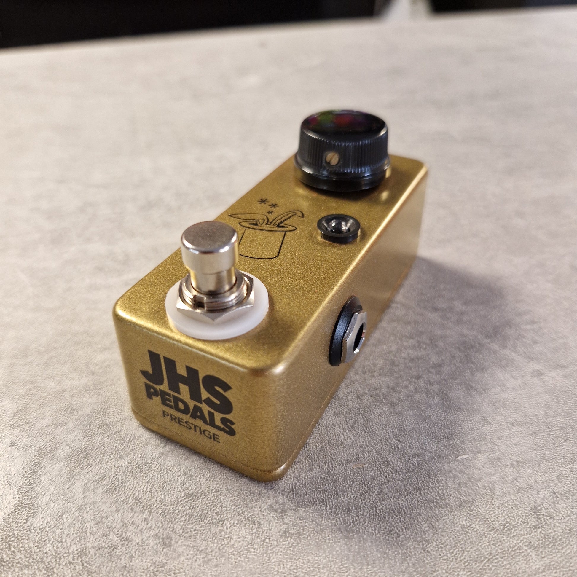 Pre-Owned JHS Gold JHS Pedals guitar effects pedal on a gray surface