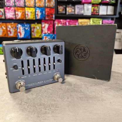 Pre-Owned Darkglass Guitar effects pedal with a branded box on a counter