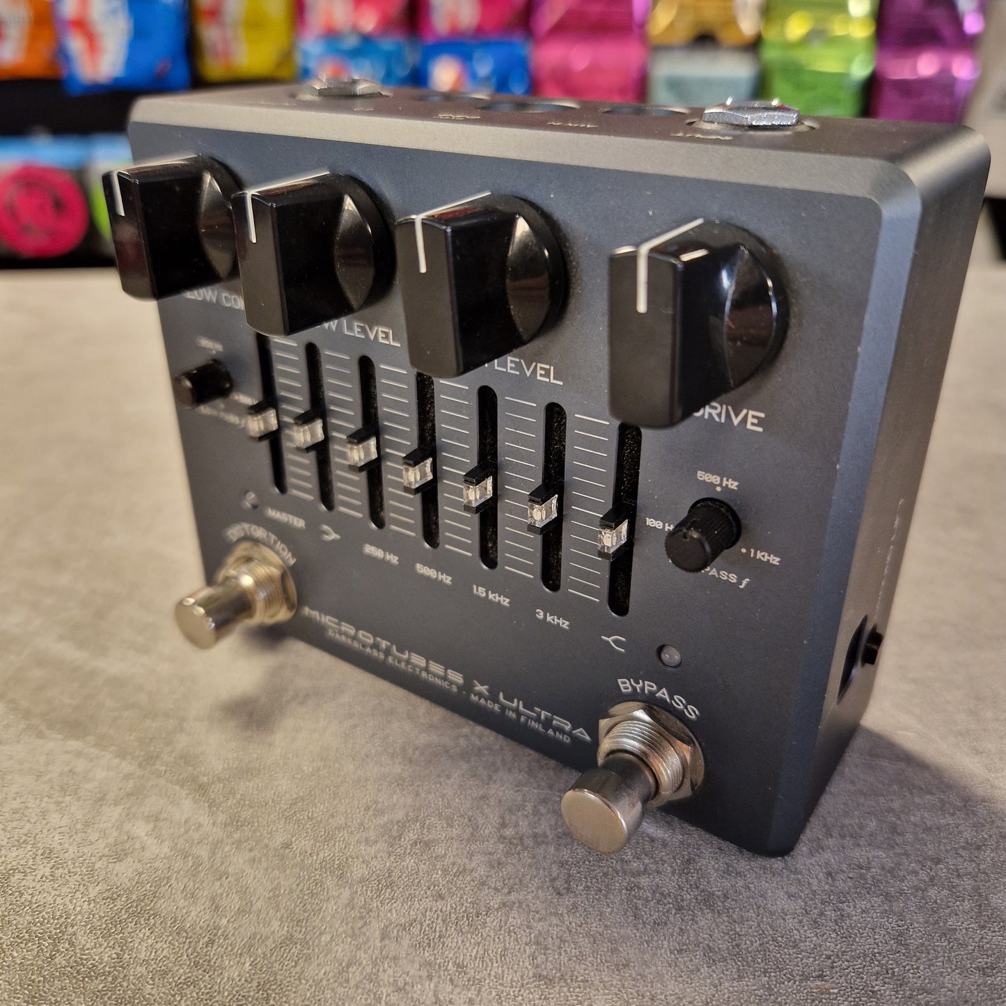 Pre-Owned Darkglass Black guitar effects pedal with control knobs on a gray surface