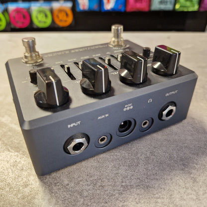 Pre-Owned Darkglass Audio effects pedal with various knobs and connectors on a gray surface.