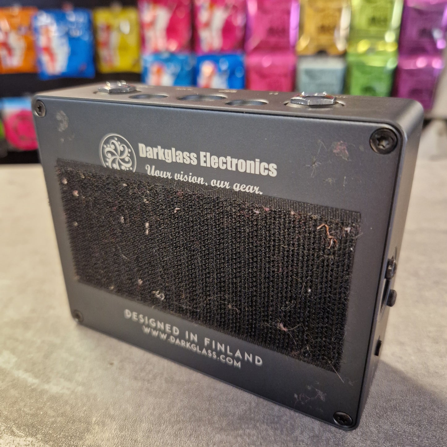 Pre-Owned Darkglass Small electronic device with 'Darkglass Electronics' branding on a gray surface.