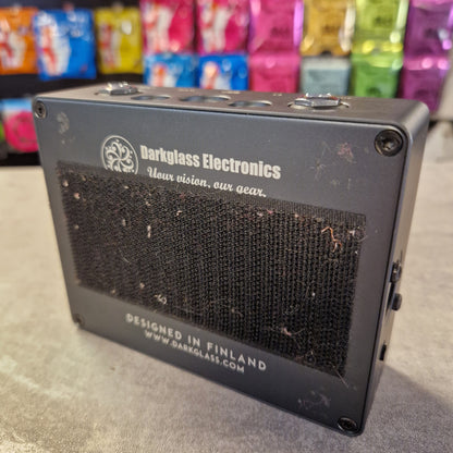 Pre-Owned Darkglass Small electronic device with 'Darkglass Electronics' branding on a gray surface.