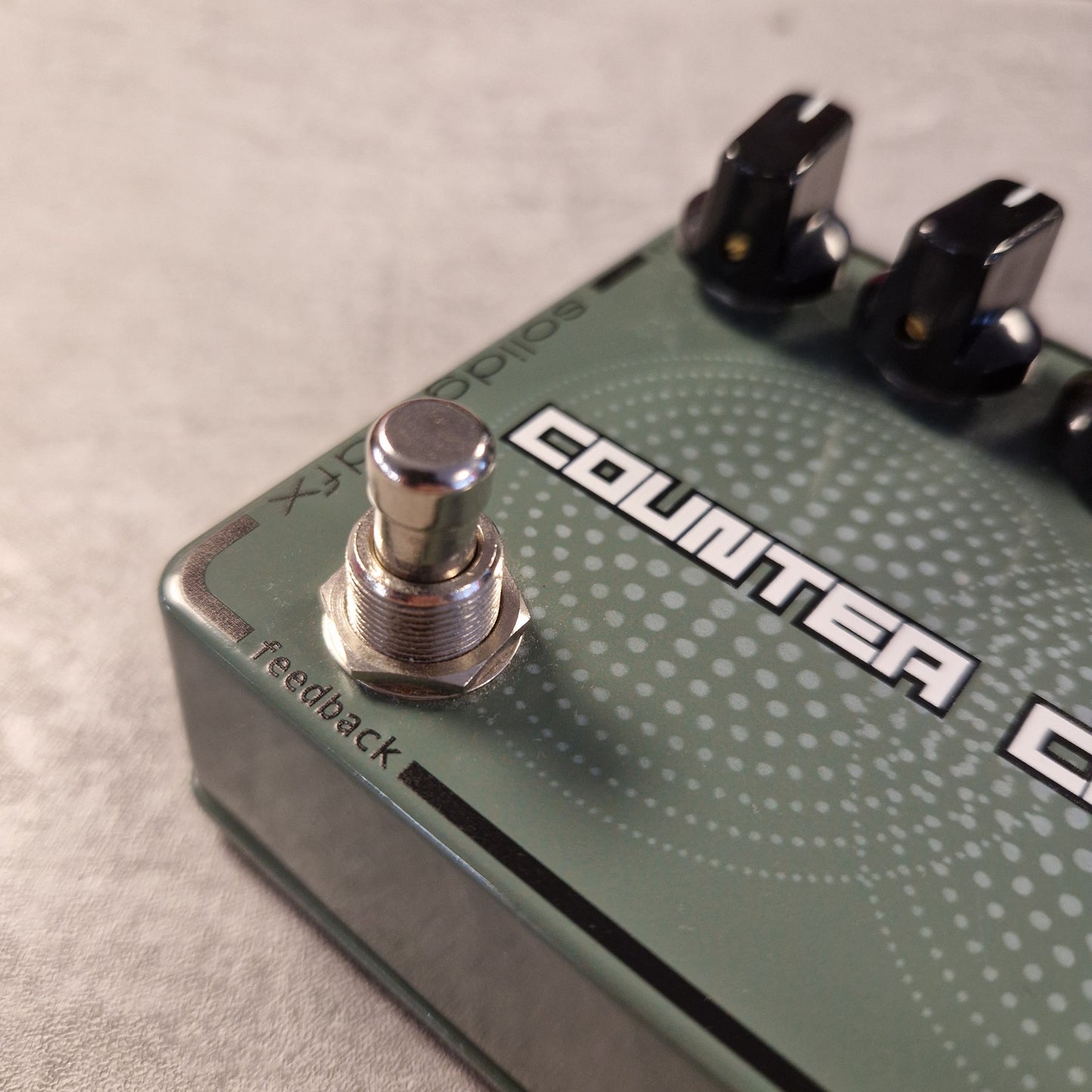 Pre-Owned SolidGoldFx Close-up of a guitar effects pedal with 'SolidGoldFX' branding on a neutral background