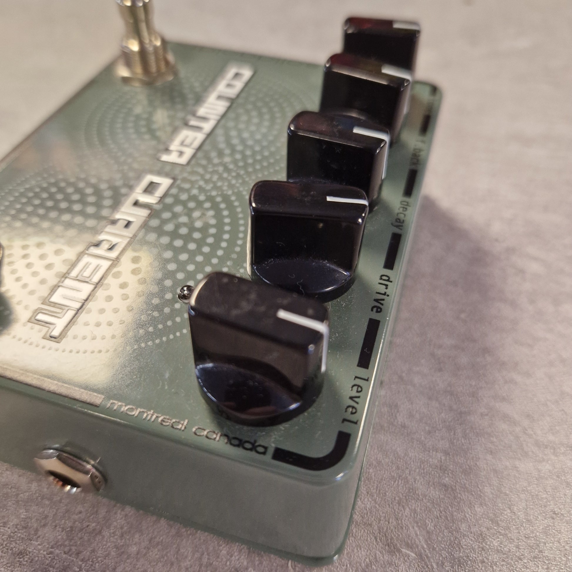 Pre-Owned SolidGoldFx Guitar effects pedal with knobs and branding on a textured surface