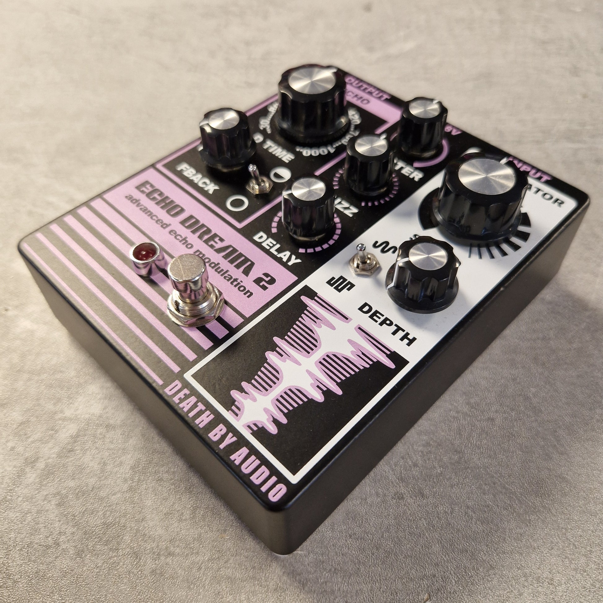 Pre-Owned Death By Audio Guitar effects pedal with 'Death by Audio' branding on a textured surface