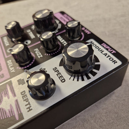 Pre-Owned Death By Audio Guitar effects pedal with control knobs and labels on a gray background
