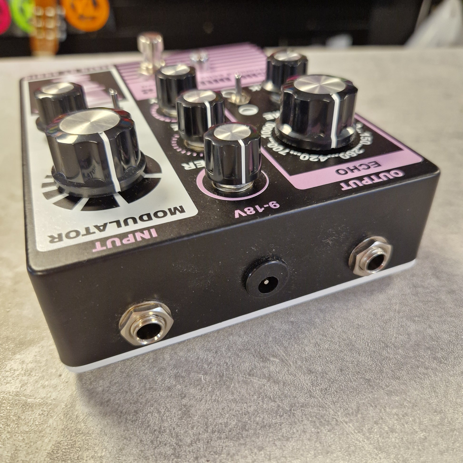 Pre-Owned Death By Audio Guitar effects pedal with knobs and labels on a gray surface