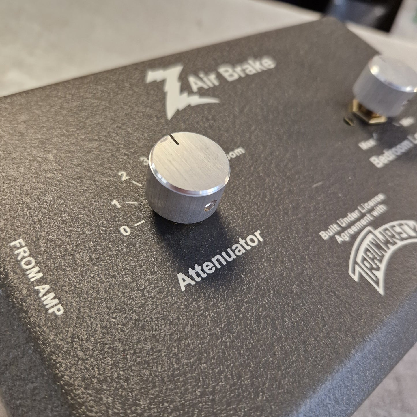 Pre-Owned Dr. Z Trainwreck Guitar effects pedal with a knob and 'Fender' branding on a dark surface.