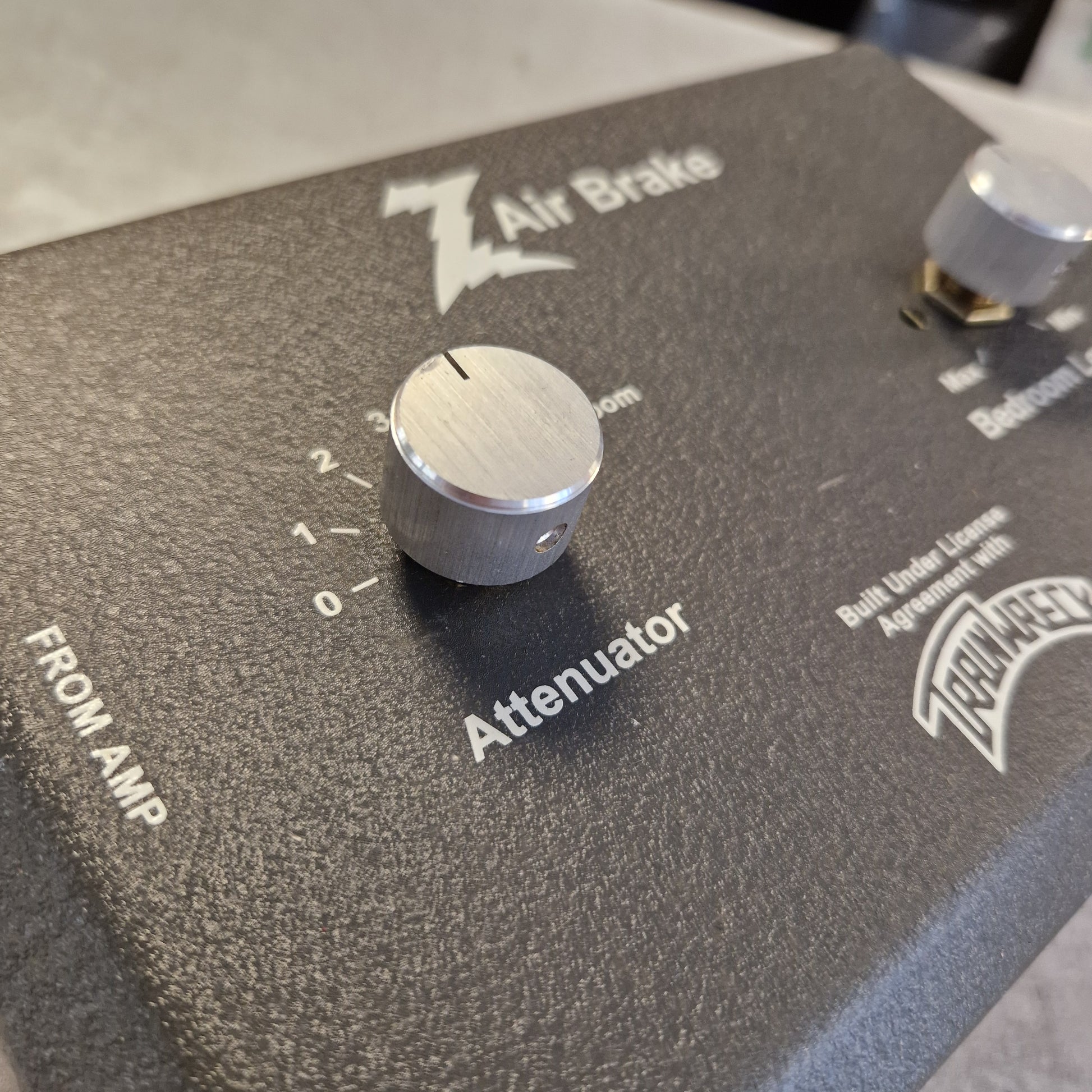 Pre-Owned Dr. Z Trainwreck Guitar effects pedal with a knob and 'Fender' branding on a dark surface.