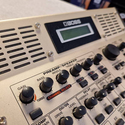 Pre-Owned Boss GS-10 Close-up of a Boss guitar amplifier with control knobs and display.