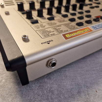 Pre-Owned Boss GS-10 Close-up of a control panel with knobs and labels on a gray surface