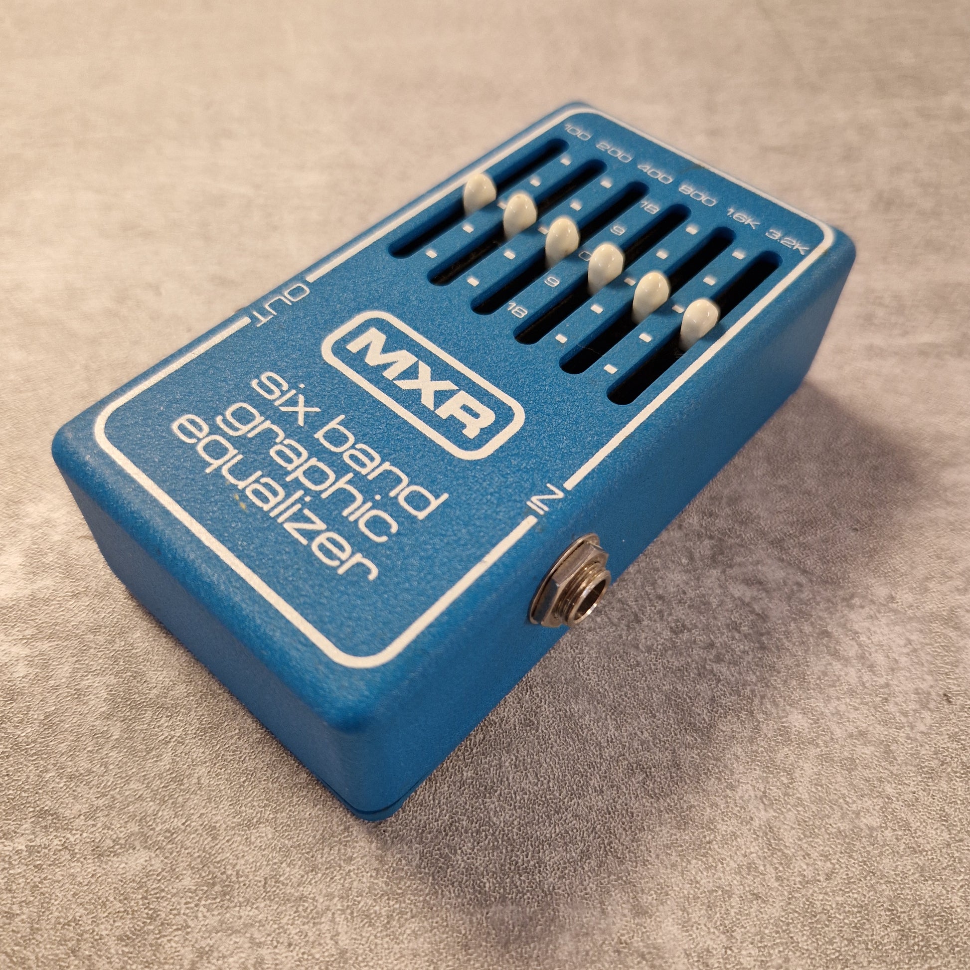 Pre-Owned MXR MX-109 Blue MXR six band graphic equalizer pedal on a textured surface
