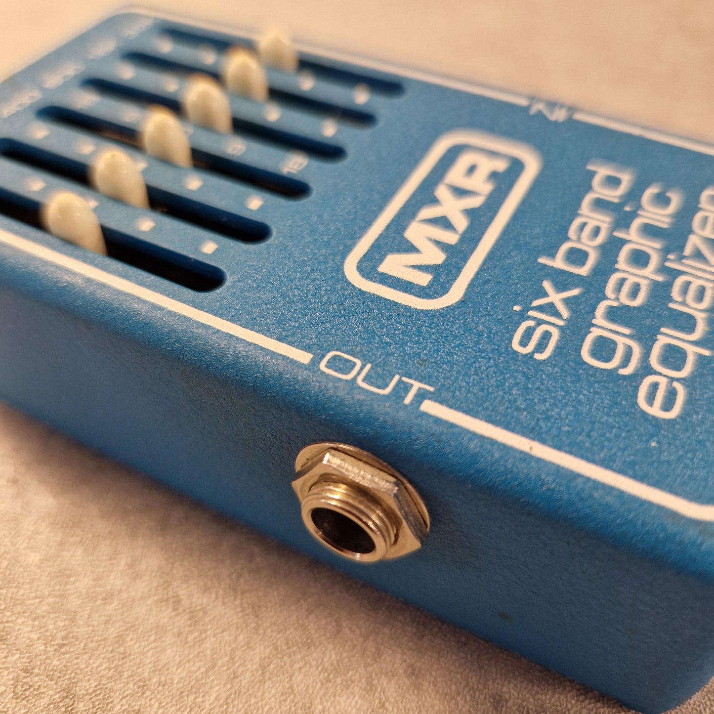 Pre-Owned MXR MX-109 Blue MXR guitar effects pedal with visible branding on a beige surface