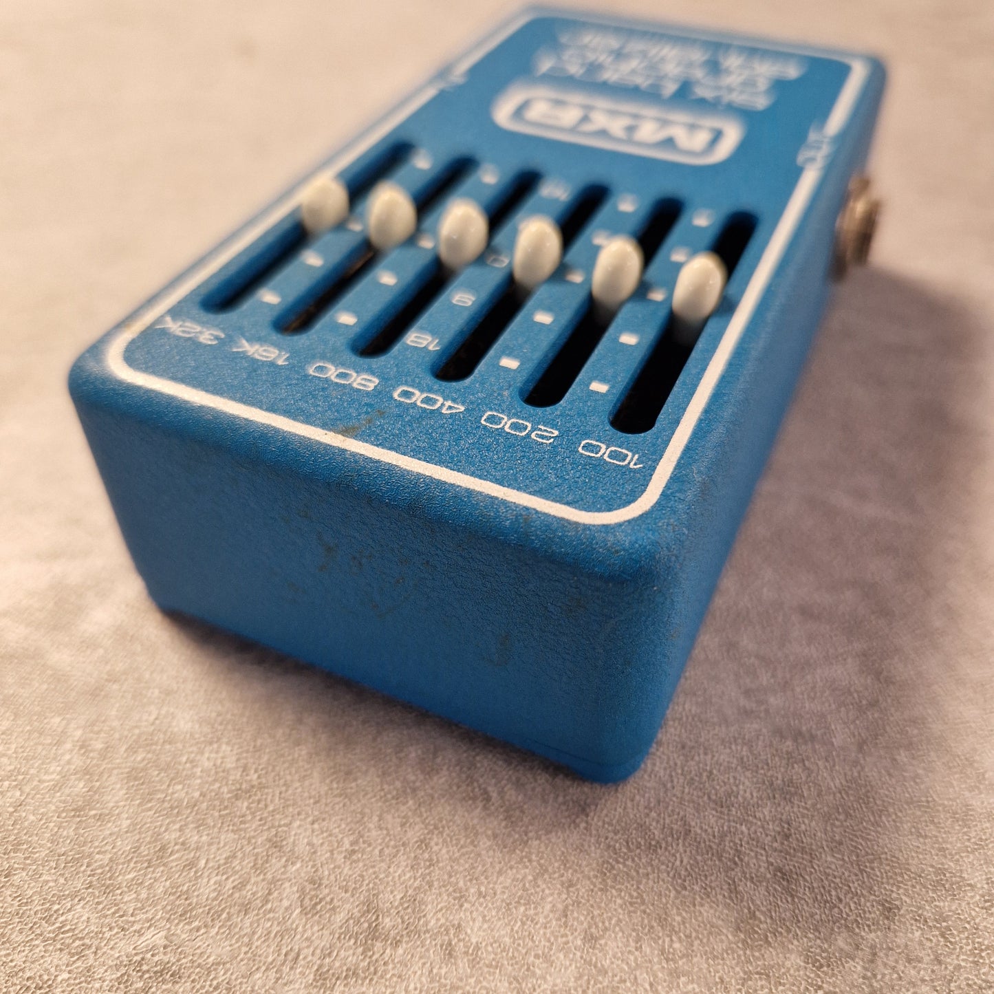 Pre-Owned MXR MX-109 Blue electronic device with dials on a textured surface