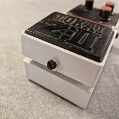 Pre-Owned Tokai Z-II TOD-2 Close-up of a metal component with branding on a gray background