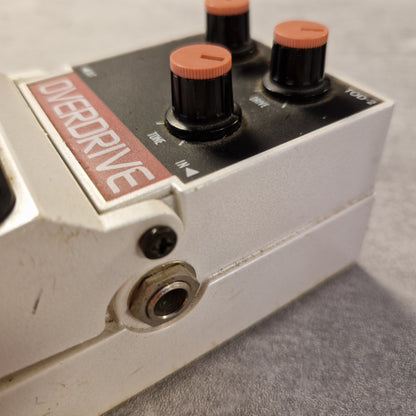 Pre-Owned Tokai Z-II TOD-2 Close-up of a guitar effects pedal with 'Overdrive' branding on a gray background