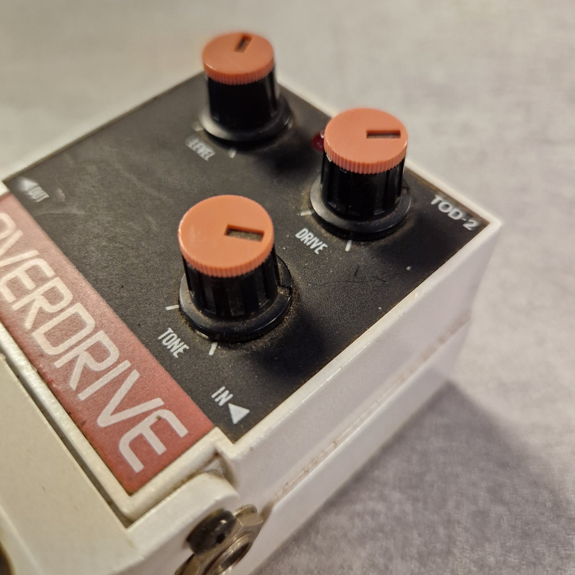 Pre-Owned Tokai Z-II TOD-2 Close-up of a guitar effects pedal with 'Overdrive' branding on a gray background