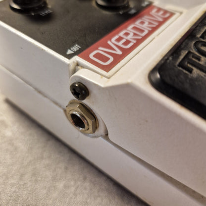 Pre-Owned Tokai Z-II TOD-2 Close-up of a guitar effects pedal with 'Overdrive' label on a gray surface
