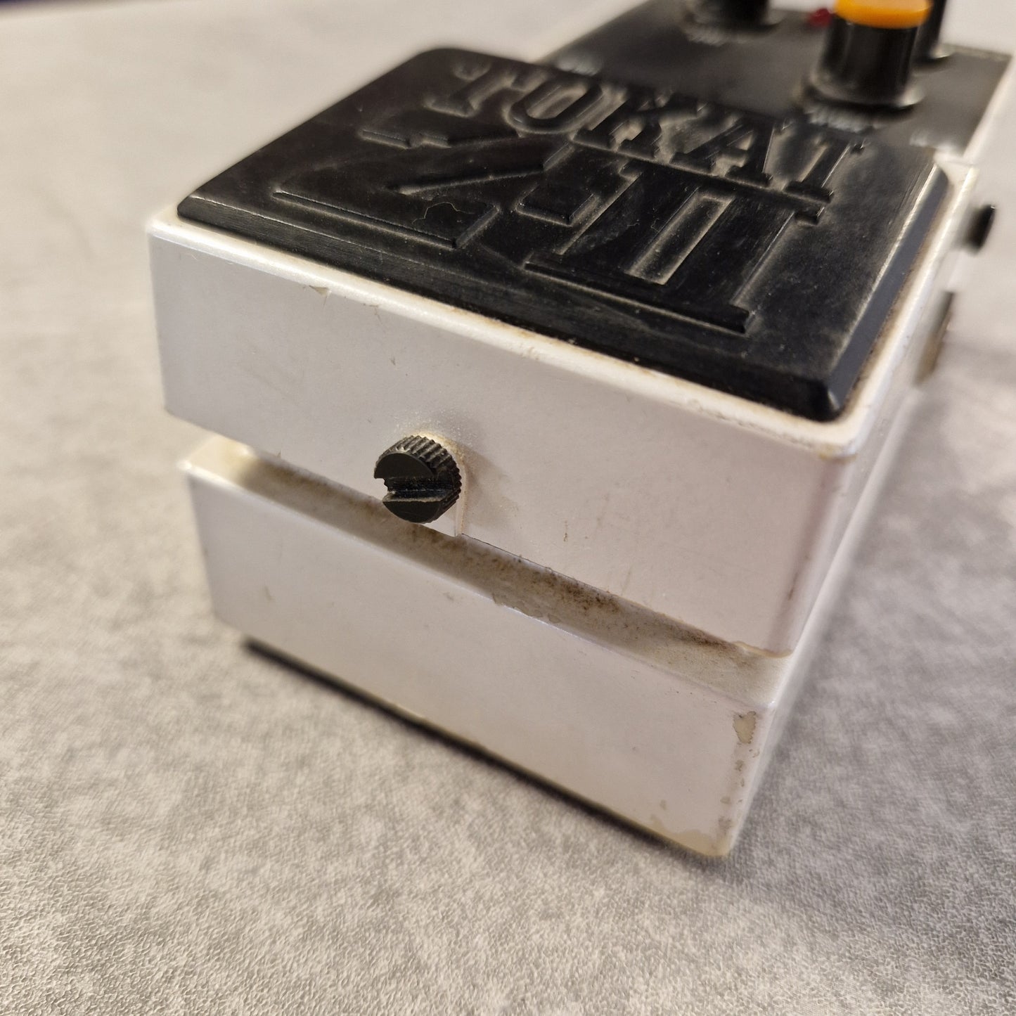 Pre-Owned Tokai Z-II TCO-2 Close-up of a guitar pedal with 'DOD' branding on a gray surface