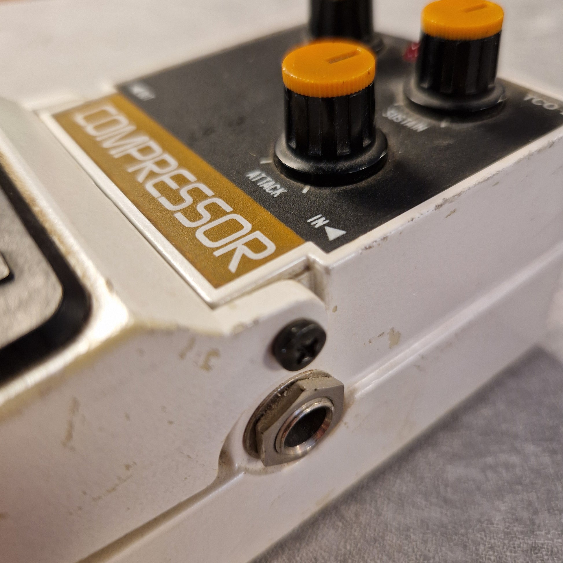 Pre-Owned Tokai Z-II TCO-2 Close-up of a compressor pedal with knobs and 'COMPRESSOR' label on a gray background